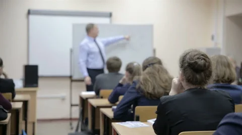 Teacher teaches in the classroom Stock Footage 61781998