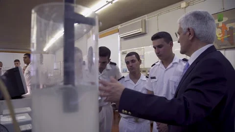 Teacher teaches to Navy students how to Measure Data in Fluid Mechanics Stock Footage 249547549