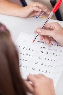 The teacher teaching and checking the homework Stock Photos