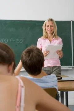 A teacher teaching a class, over the shoulder view Stock Photos