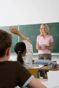 A teacher teaching a class, over the shoulder view Stock Photos