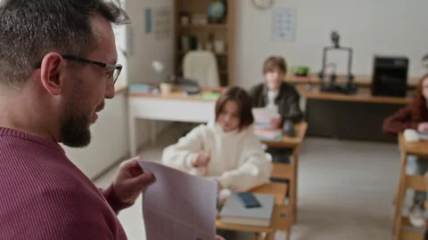 Teacher Teaching Class, While Students Listen Intently Stock Footage 335695498