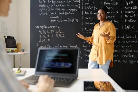 Teacher teaching IT lesson at class 스톡 사진