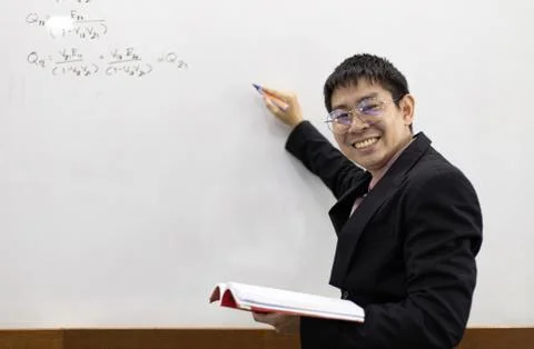Teacher is teaching physics to students during the new school days after a lo Stock Photos