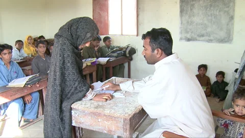 Teacher teaching student Stock Footage 202139093