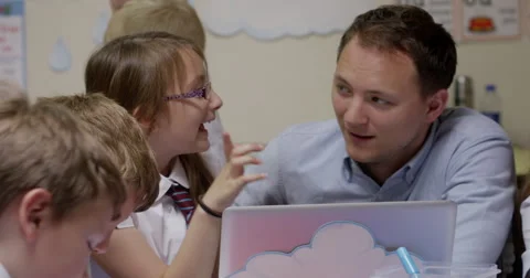 Teacher teaching students on laptop Stock Footage 58574538