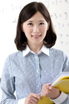 A teacher is teaching students Stock Photos