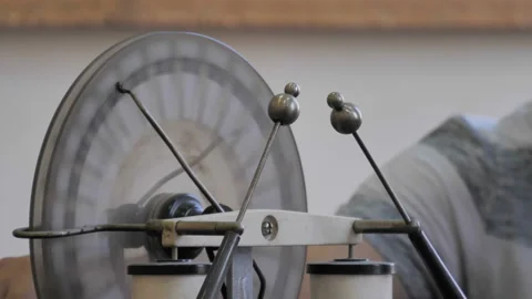 Teacher Turning The  Electrostatic Machine And Produces An Electrical Discharge  Stock Footage 137797694