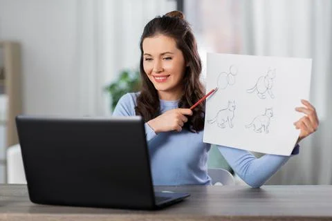 Teacher with tutorial having online class of arts Foto stock