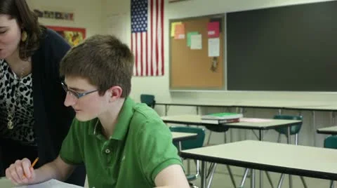 Teacher tutoring student Video stock 10787789