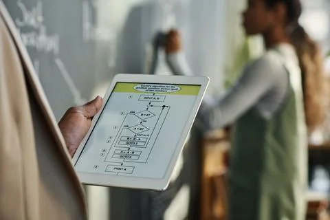 Teacher using digital tablet at lesson 写真素材