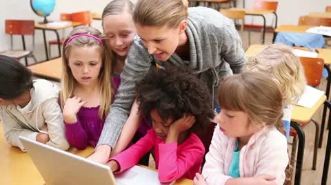 Teacher using a laptop Stock Footage 10844005