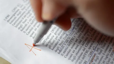 Teacher using red pen and write a good mark on the school test. test correction. Stock-Footage 228910158