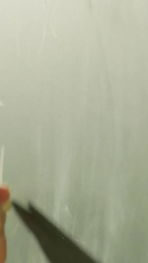 The teacher is utilizing a blackboard in the classroom to instruct students on Stock Footage 279218060