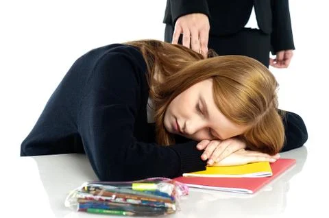 Teacher waking up a dozed off student Stock Photos