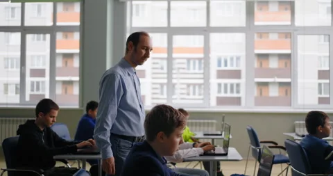 Teacher Walking In Classroom During Exam In Middle School, Teen Boys Studying Stock Footage 280174765