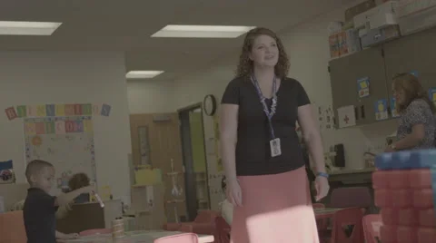 Teacher welcoming students Stock Footage 62832635