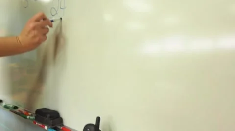 Teacher at white board Stock Footage 44315250
