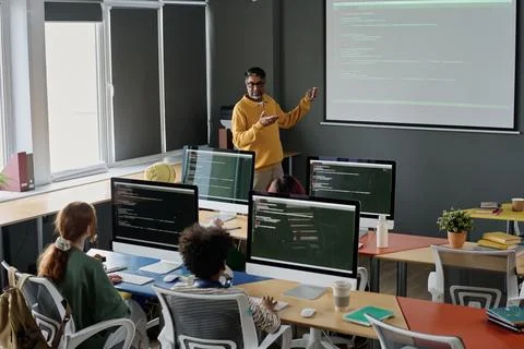 Teacher Working in Computer Science Class Stock Photos