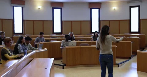Teacher working with students inside classroom at school university Stock Footage 203728173