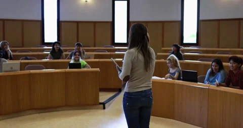 Teacher working with students inside classroom at school university Stock Footage 203728199