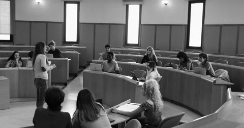 Teacher working with students inside classroom at school university Stock Footage 203728505