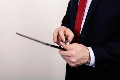 Teacher working on a tablet, close up, on a white background Foto stock