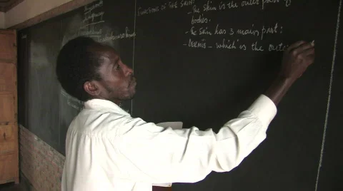 Teacher Writes Lesson Stock Footage 113805