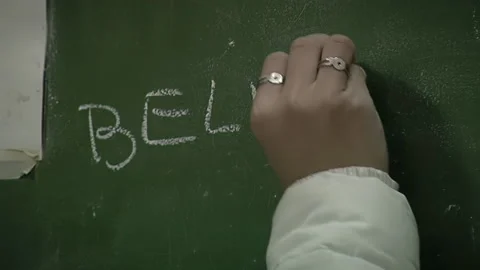 Teacher Writing On Chalkboard During Class Stock Footage 331382709