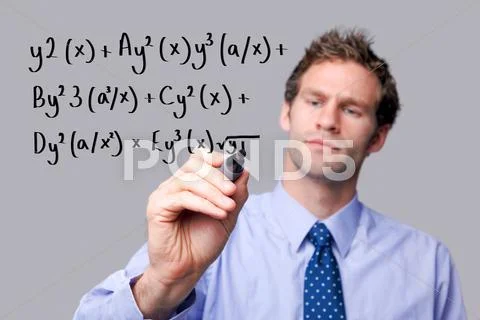 Teacher writing a maths equation. Stock Photos
