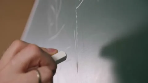 Teacher writing various mathematical formulas on a blackboard at a university. Stock Footage 149293141