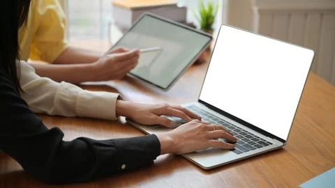 Teachers are preparing laptops for online teaching work for students at home. Photos