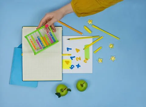 Teachers hands on math lesson in elementary school. New ways to teach arithme Stock Photos