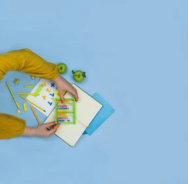 Teachers hands on the table with arithmetic stationery...How to teach mathema Stock Photos