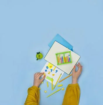 Teachers hands on the table with arithmetic stationery...How to teach mathema 스톡 사진