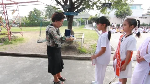 Teachers reward students at Elementary School. Pieamsuwan school Stock Footage 61380142