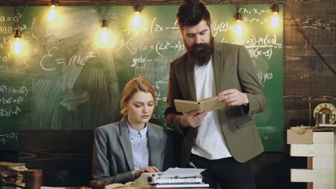 Teachers is searching for knowledge in the library. Stock Footage 144037131