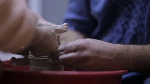 Teaches the child how to make a pot Stock Footage 70173374