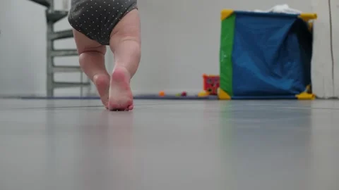 Teaching baby his first steps Stock Footage 339190612