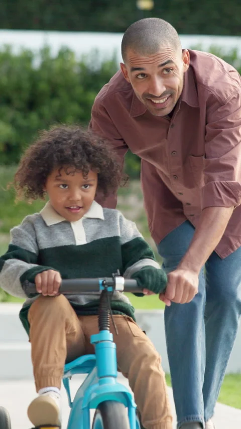 Teaching, bicycle and father with kid in nature for bonding, activity or love Stock Footage 335260010