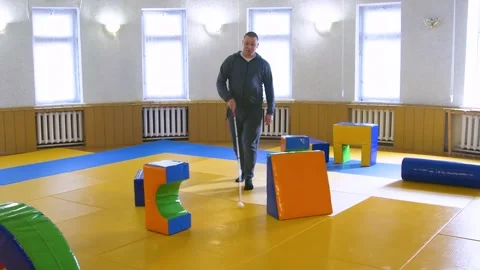 Teaching the blind to walk with a cane. 스톡 동영상 303358099