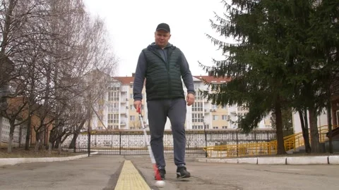 Teaching the blind to walk with a cane. Stock Footage 303358203