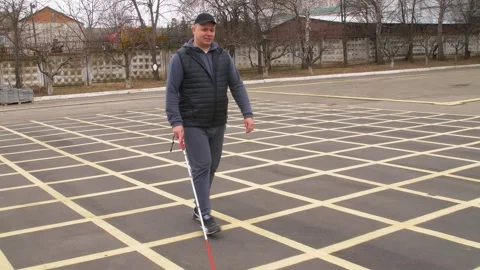 Teaching the blind to walk with a cane. Stock Footage 303358216