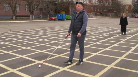 Teaching the blind to walk with a cane. Stock Footage 303358295