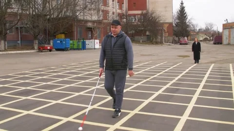 Teaching the blind to walk with a cane. Stock Footage 303358326