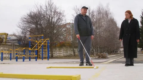 Teaching the blind to walk with a cane. Stock Footage 303358335
