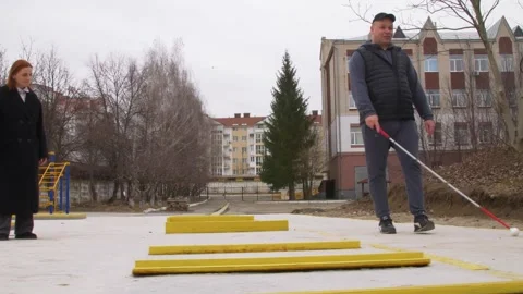 Teaching the blind to walk with a cane. Stock Footage 303358398