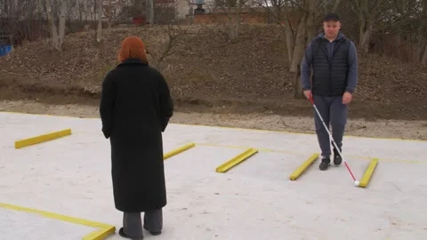 Teaching the blind to walk with a cane. Stock Footage 303358459