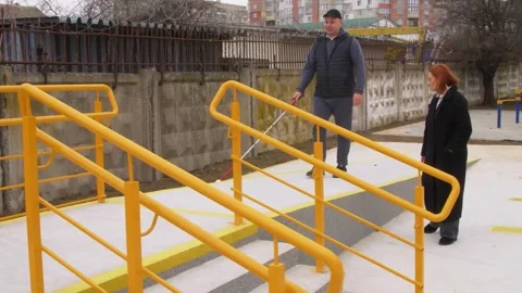 Teaching the blind to walk with a cane. Stock Footage 303358534
