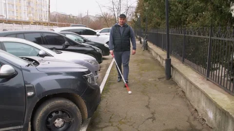 Teaching the blind to walk with a cane. Stock Footage 303358540